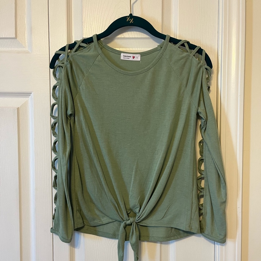 A cute long sleeve shirt from Beautees. Never worn.